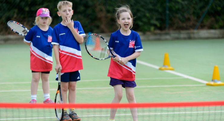 Child playing tennis